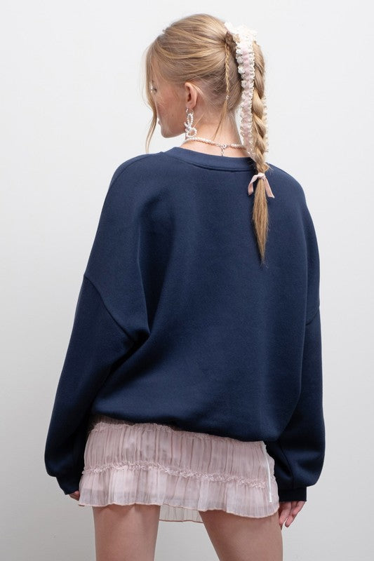BOW GRAPHIC SWEATSHIRT