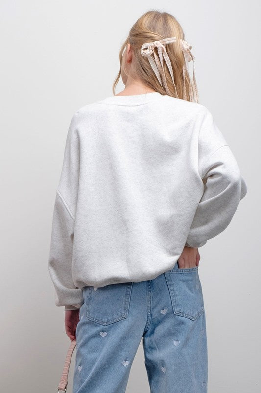 BOW GRAPHIC SWEATSHIRT