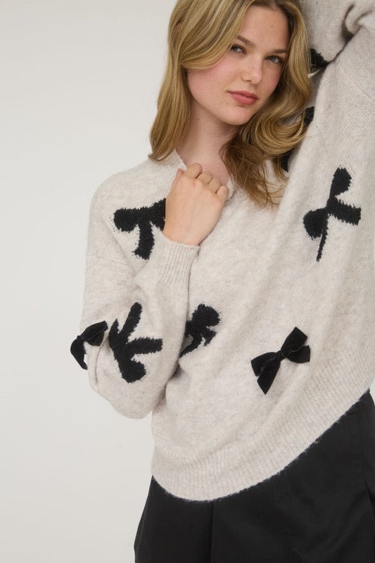 STATEMENT BOW DETAIL SWEATER