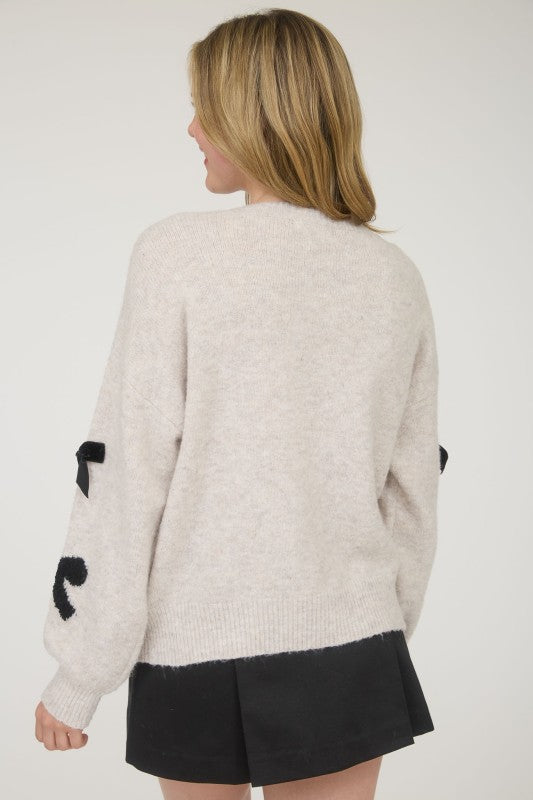 STATEMENT BOW DETAIL SWEATER