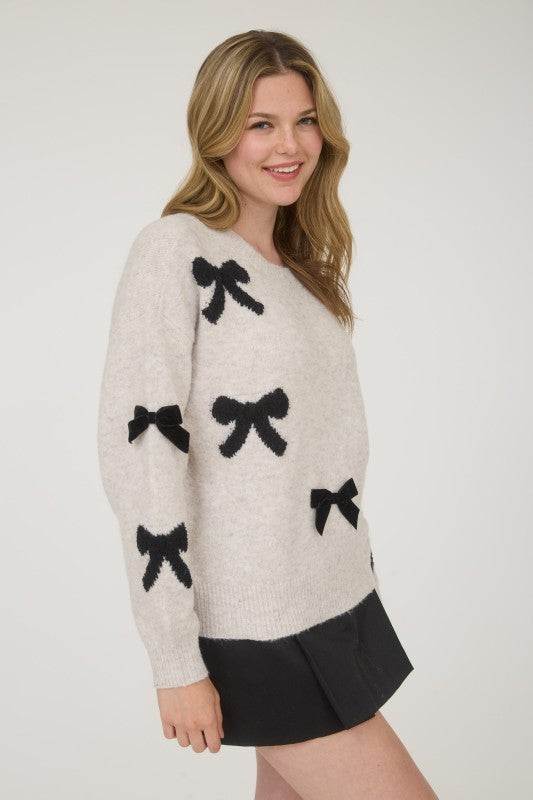 STATEMENT BOW DETAIL SWEATER