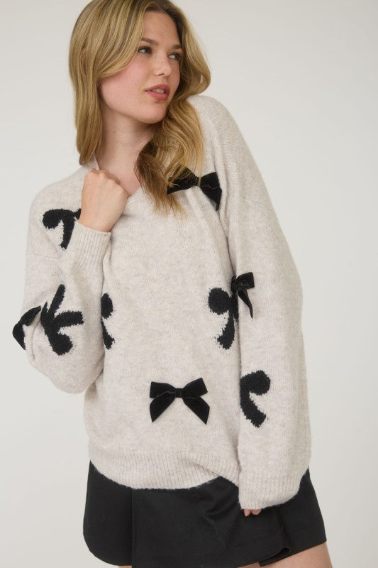 STATEMENT BOW DETAIL SWEATER