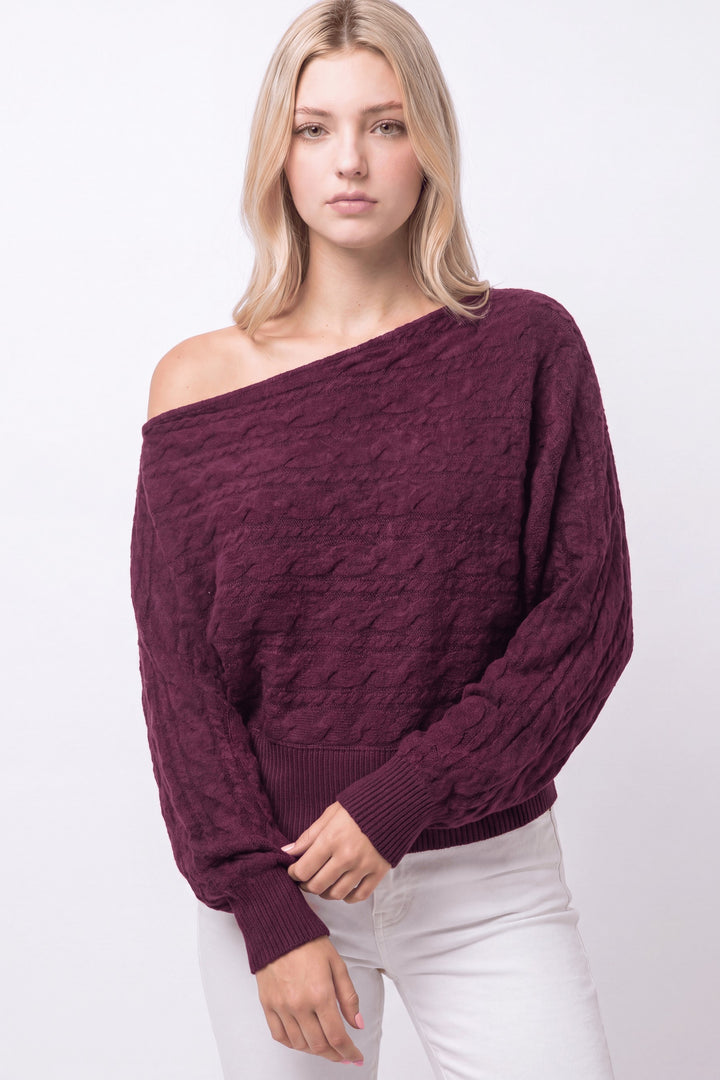 CABLE KNIT ASYMMETRICAL SWEATER