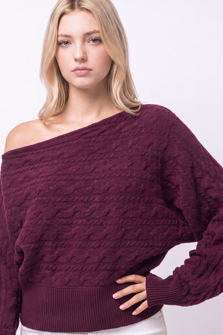 CABLE KNIT ASYMMETRICAL SWEATER